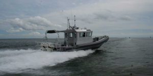 Silver Ships Ambar Series AM 1100 patrol boat with full pilothouse and awning back view