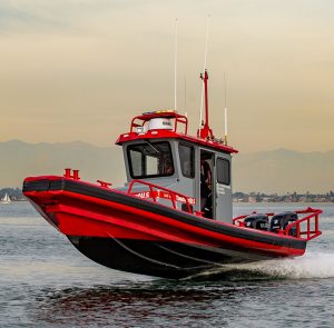 Gray and red Ambar series tow boat on the water