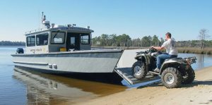 Silver Ships Explorer Series with bow gate down and ATV coming on to the boat