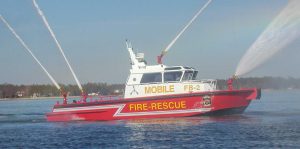 Silver Ships Mobile fire and rescue boat spraying all four hoses
