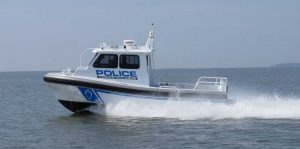 Small police boat with full pilothouse