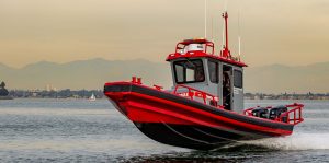 Red and gray Tow Boat U.S. Ambar boat in Long Beach, CA